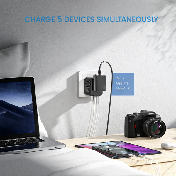 Universal Travel Power Adapter with 4 USB Ports – Compact and Safe Charging Solution for Global Use 4